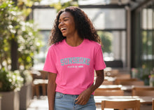 Load image into Gallery viewer, Woman wearing a pink 'Sunshine State of Mind' t-shirt outdoors.