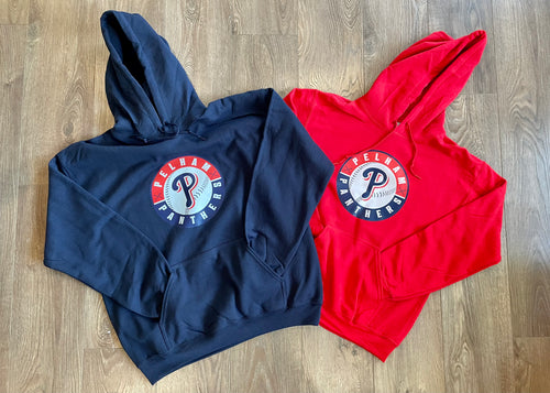 Navy and red hoodies with a logo on a wooden surface