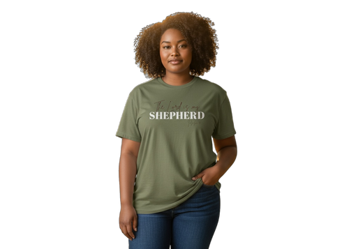 Woman wearing a green t-shirt with 'Shepherd' printed on it against a white background