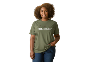 Woman wearing a green t-shirt with 'Shepherd' printed on it against a white background