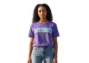 Person wearing a purple 'SUNKISSED' t-shirt on a white background