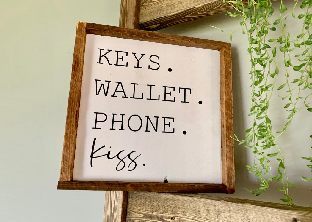 Keys. Wallet. Phone. Kiss. Sign
